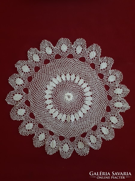 Delicate crocheted lace tablecloth with a rose in the middle