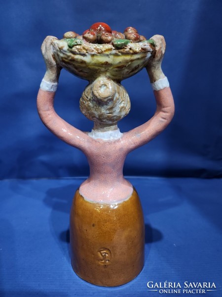 Ceramic marked woman with a basket of apples