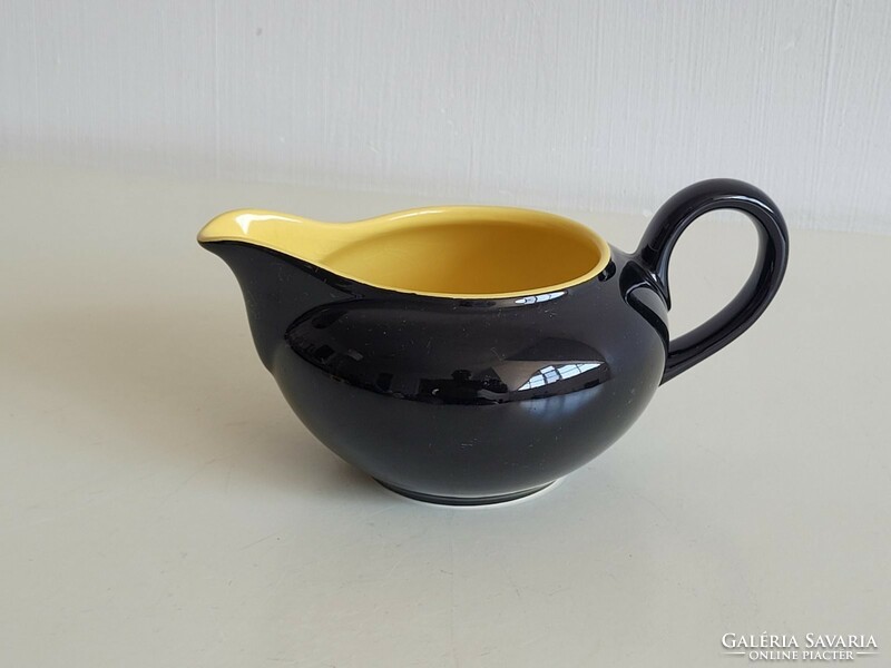 Glazed ceramic pouring black yellow small jug