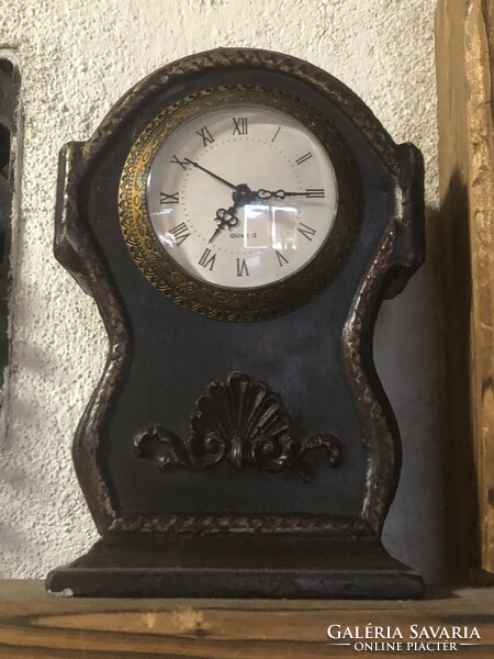 Antique wooden table clock with leather coating