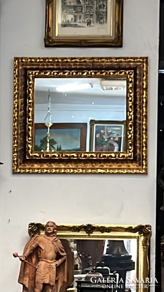 Wall mirror in a decorative frame