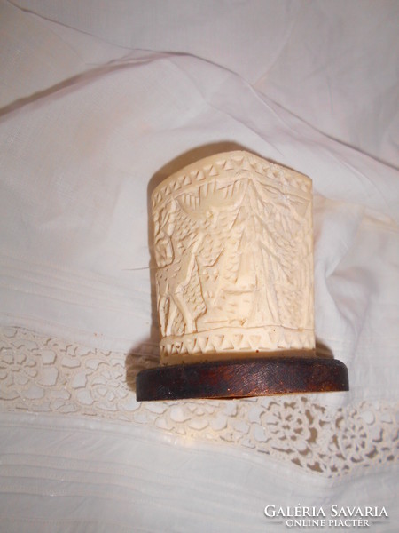Juryed carved bone table holder - wooden base