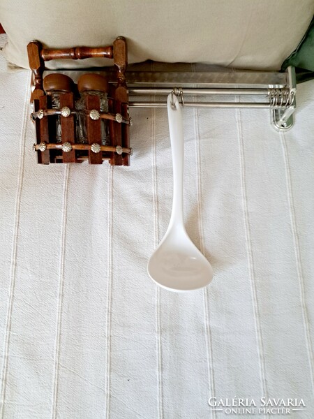 Retro kitchen take-out, tea towel rail, plastic ladle and spice holder together