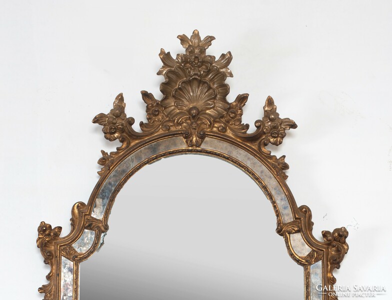Gilded wooden mirror decorated with plastic flowers