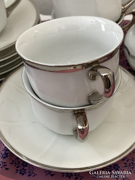 Antique coffee set with thick silver edge and handle