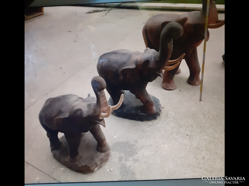 3 giant elephants made of tropical wood.