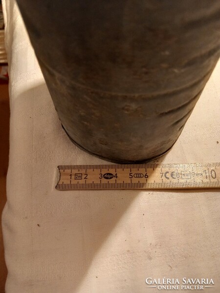 Some kind of measuring device, marked on the bottom