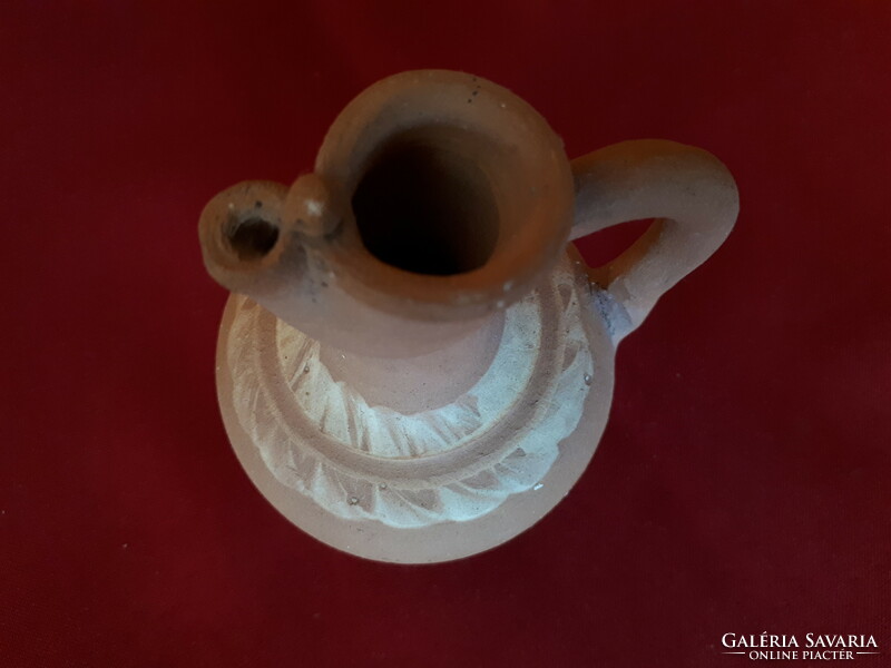Unglazed ceramic jug