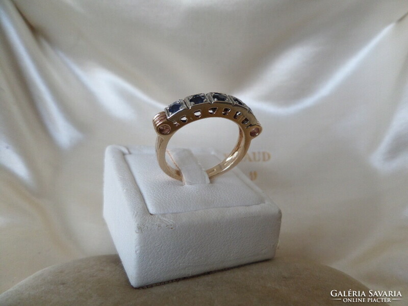 Gold row ring with sapphires