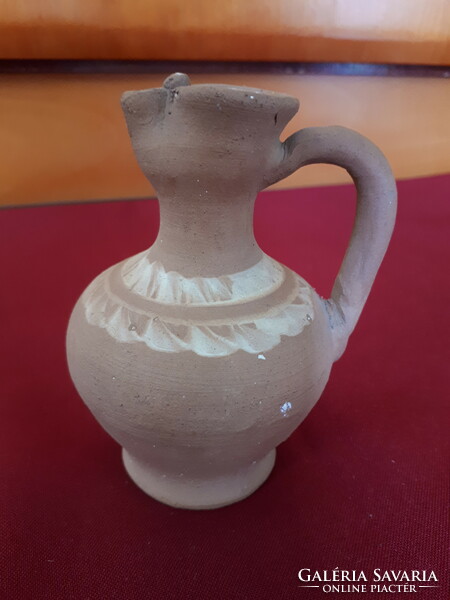 Unglazed ceramic jug