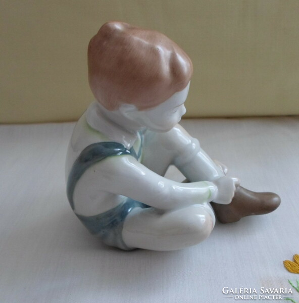 Retro nipp 10.: Boy wearing Aquincum porcelain, little boy pulling shoes (turquoise / blue pants)