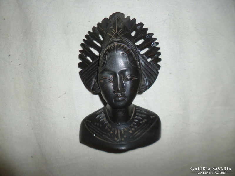 Carved wooden female head sculpture