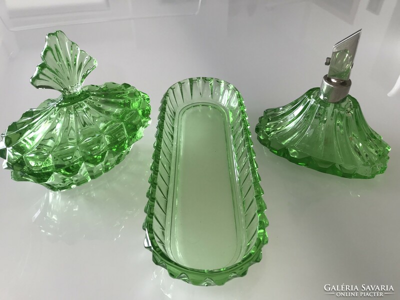 Antique toilet set made of bright green glass