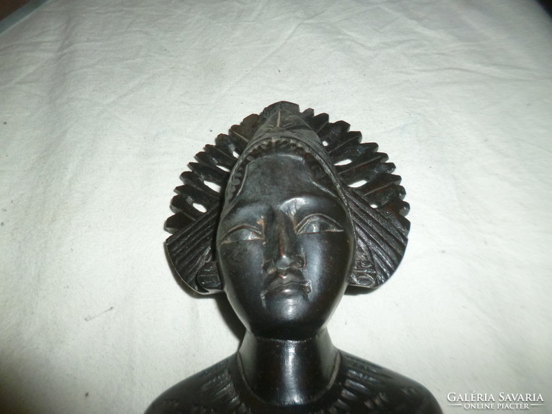 Carved wooden female head sculpture