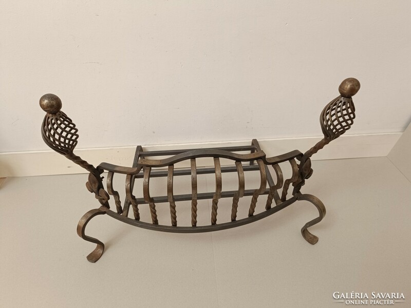 Antique wrought iron stove ember holder in front of the fireplace 909 7508