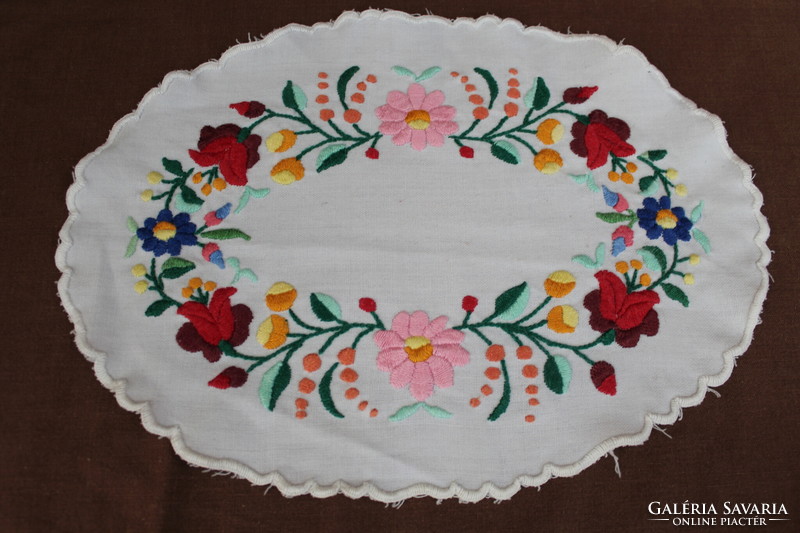 Old oval embroidered tablecloth