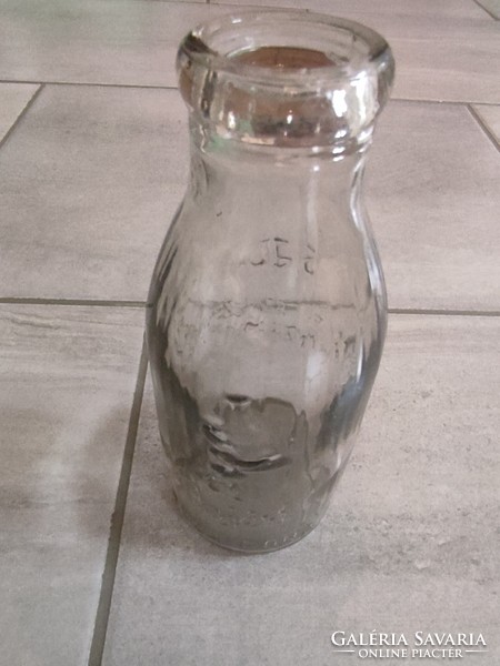 Old collection of four milk bottles