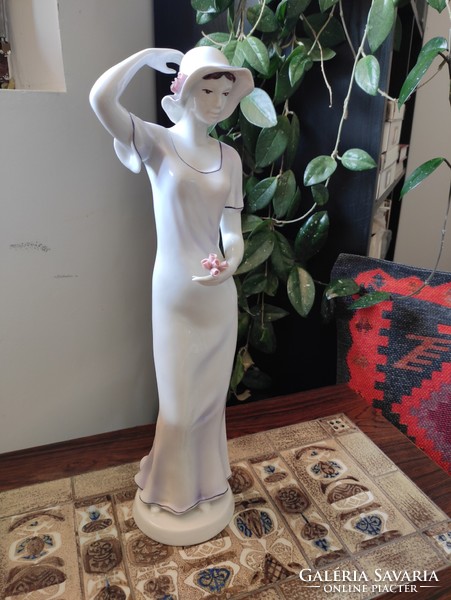 A huge raven house porcelain lady with a hat in a flowing dress with roses, jubilee serial numbered piece