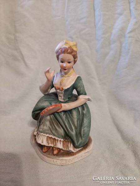 Seated woman in baroque green dress ceramics