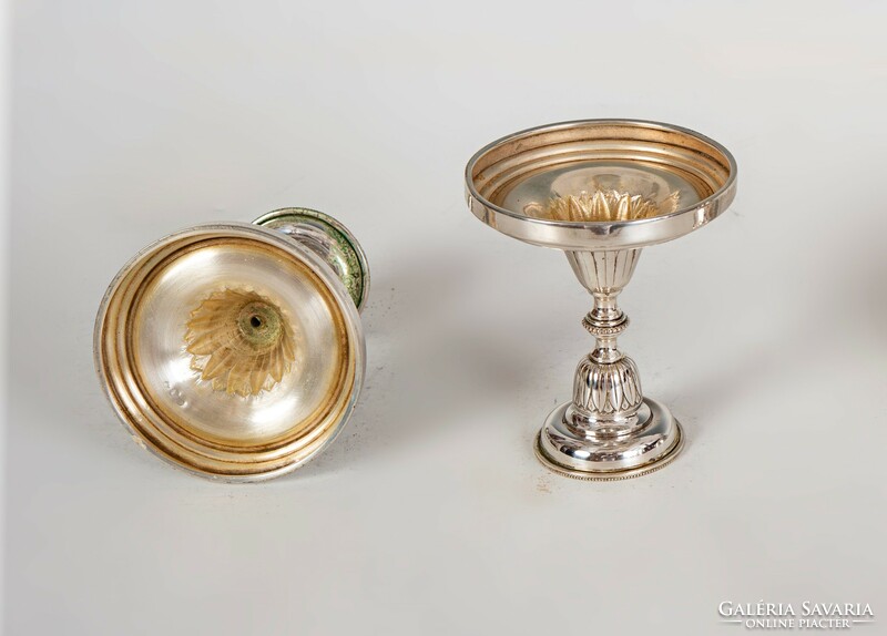 Pair of silver candlesticks with stylized leaf decor