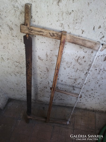 Old wooden frame saw