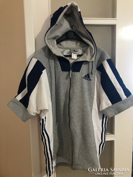 Adidas brand training dress. Gray color with dark blue stripe. The top is hooded. Size 42-44.