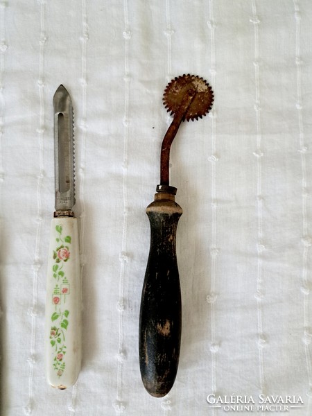 Retro, vintage kitchen tools: meat grinder, poultry / chicken shears, potato peeler, potato slicer together