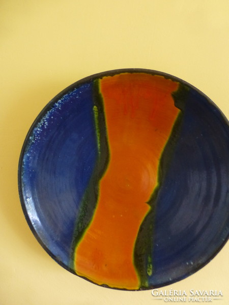 A huge orange-blue ceramic bowl created by Mónica Laborcz