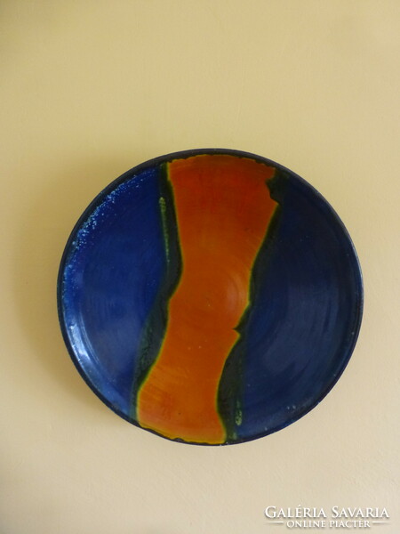 A huge orange-blue ceramic bowl created by Mónica Laborcz