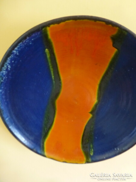 A huge orange-blue ceramic bowl created by Mónica Laborcz