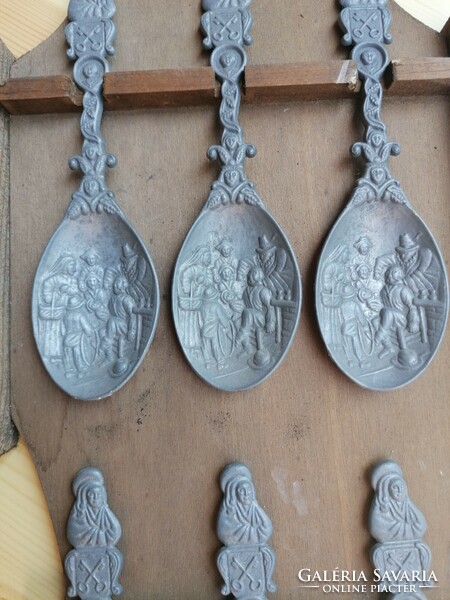 6 vintage pewter spoons with a historical relief motif