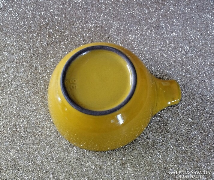 Yellow ceramic drinking vessel