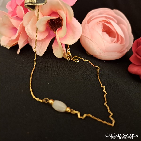 Gold-plated necklaces with mother-of-pearl stones.