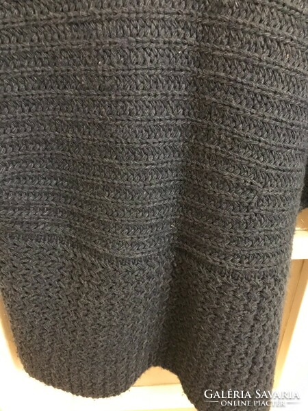 Bluish gray short-sleeved knitted sweater. With a button at the front. Special style. Bought in Austria.