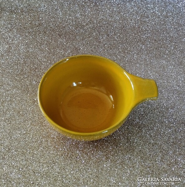 Yellow ceramic drinking vessel