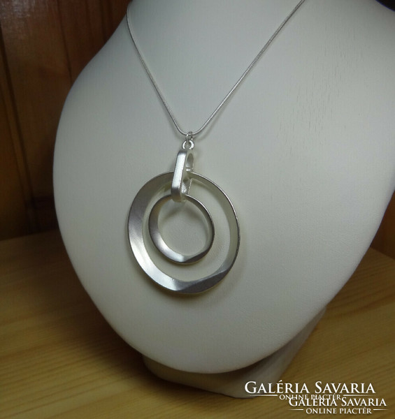 Very nice matte silver long necklace with a special pendant.