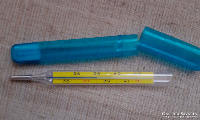 Old marked glass thermometer in its case