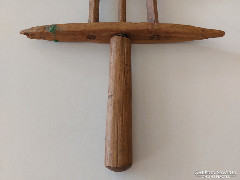 Old hand-made wooden thread winder, a folk sewing tool