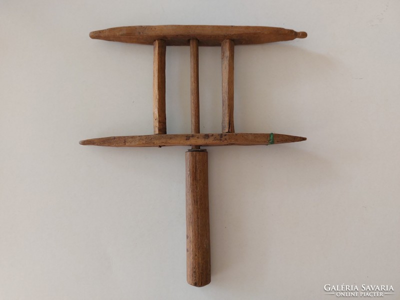Old hand-made wooden thread winder, a folk sewing tool