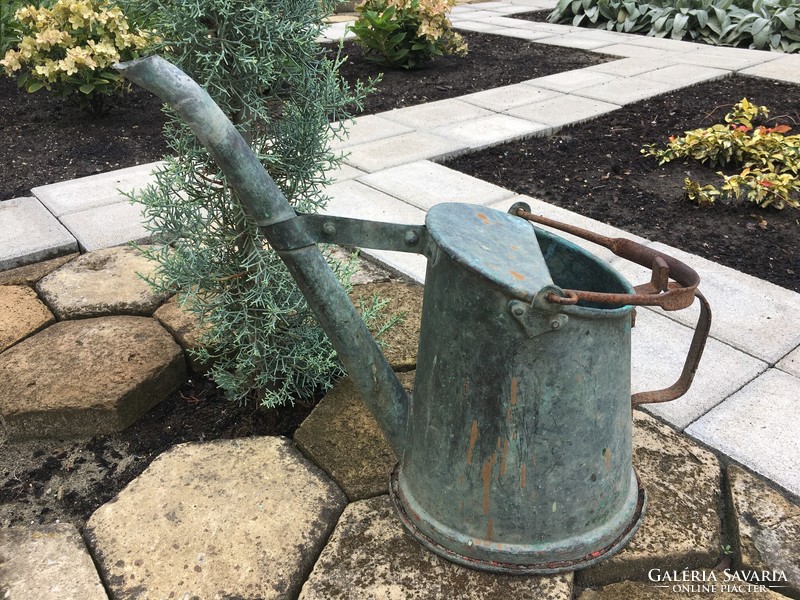 Old copper watering can