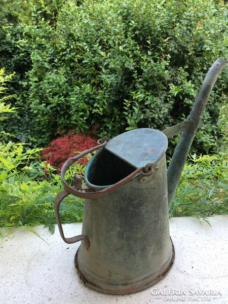 Old copper watering can