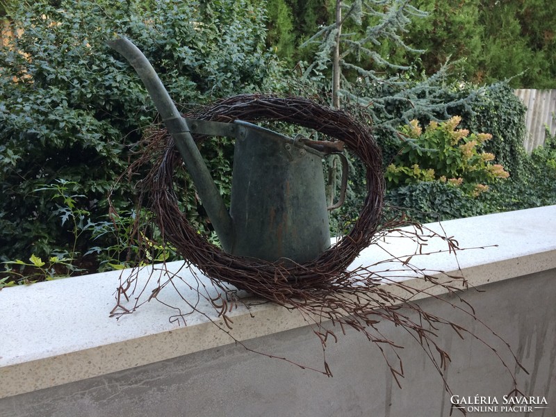 Old copper watering can