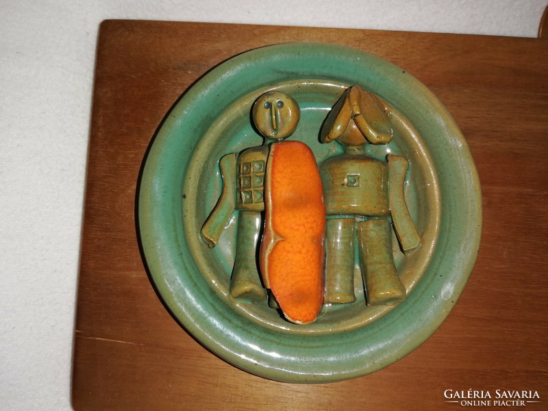 Wooden calendar holder decorated with art deco ceramic sculptures