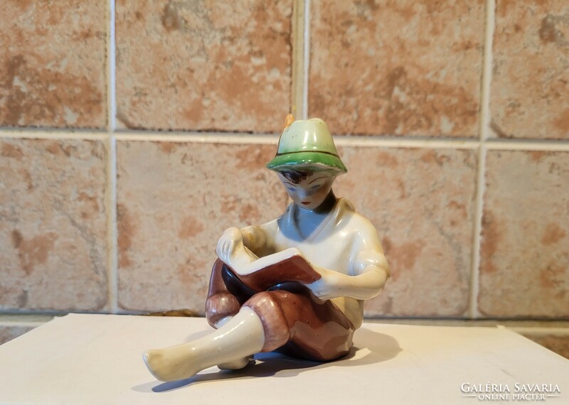 Boy reading a porcelain book in Kőbánya