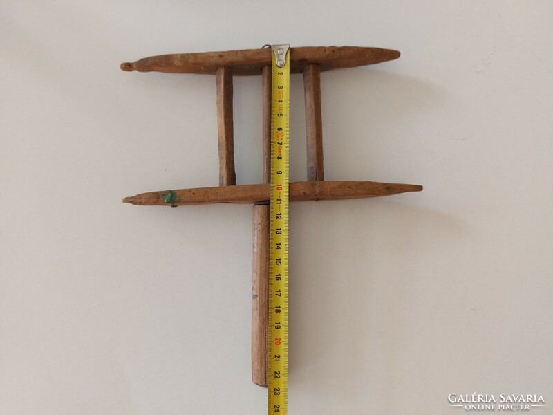 Old hand-made wooden thread winder, a folk sewing tool