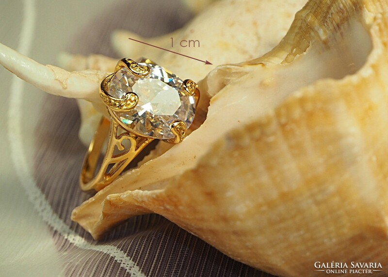 Gold-colored (goldfilled) ring with a white stone