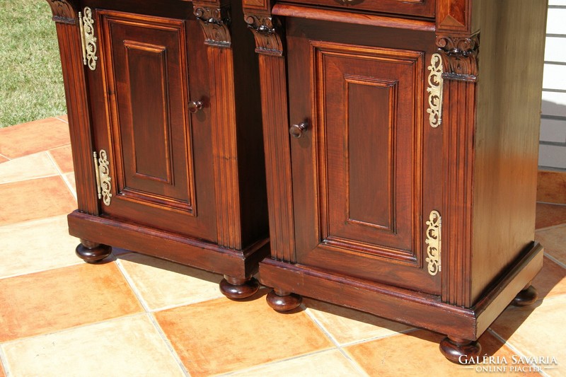 A pair of German marble bedside tables left and right