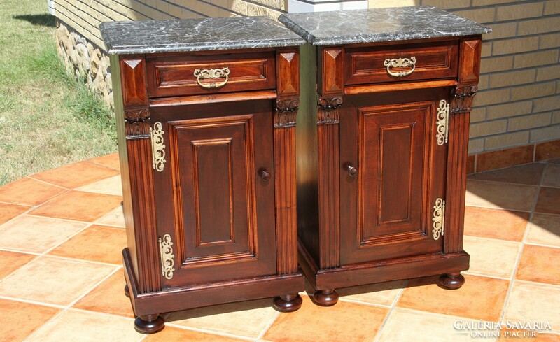 A pair of German marble bedside tables left and right