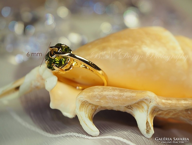 Gold-colored (goldfilled) ring with olive-green stones