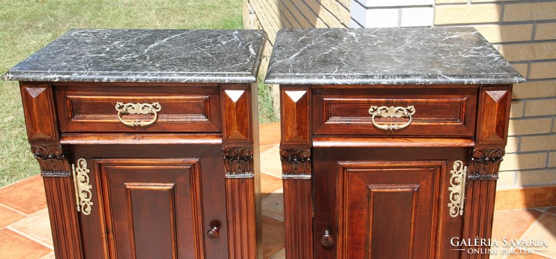 A pair of German marble bedside tables left and right